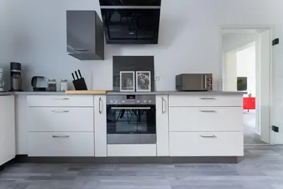 Küche/Küchenzeile in der Unterkunft Zentrales 75qm Apartment Tischfußball & Komfort