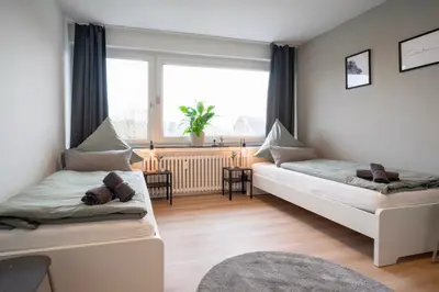 Ein Bett oder Betten in einem Zimmer der Unterkunft Juno - #1 Terrassen-Apartment, Netflix, WLAN