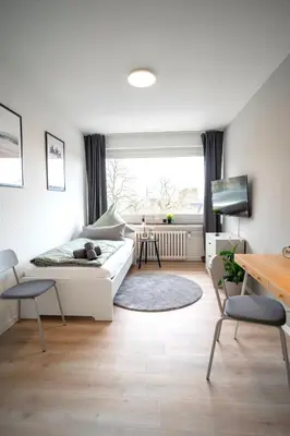 Ein Bett oder Betten in einem Zimmer der Unterkunft Juno - #1 Terrassen-Apartment, Netflix, WLAN