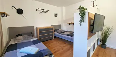 Ein Bett oder Betten in einem Zimmer der Unterkunft Charlie Apartment - Zentral in Solingen - Für bis zu 5 Personen