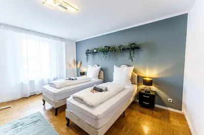 Ein Bett oder Betten in einem Zimmer der Unterkunft Große Terassen-Wohnung mit Grill, Playstation 5, Billardtisch und Massagesessel