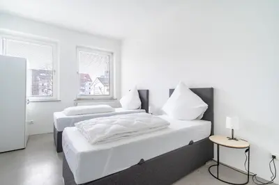 Ein Bett oder Betten in einem Zimmer der Unterkunft Beyond Living® I 235 m² LOFT I Billard I Kamin