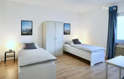 Ein Bett oder Betten in einem Zimmer der Unterkunft BEGE APARTMENTS: WORK HEAVEN