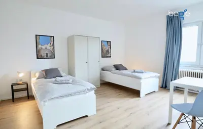 Ein Bett oder Betten in einem Zimmer der Unterkunft BEGE APARTMENTS: WORK HEAVEN