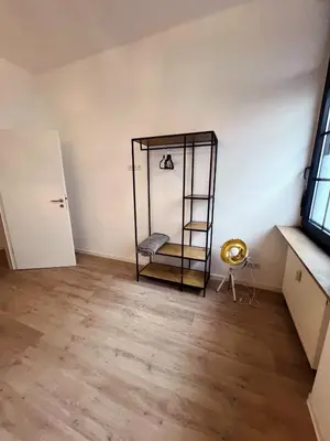 Ein Bett oder Betten in einem Zimmer der Unterkunft Wohngut-City Appartement 3 für max 5 Personen inklusive Parkplatz