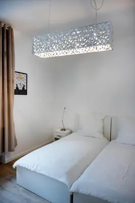 Ein Bett oder Betten in einem Zimmer der Unterkunft Wohngut-City Appartement 3 für max 5 Personen inklusive Parkplatz
