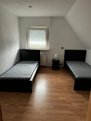 Ein Bett oder Betten in einem Zimmer der Unterkunft Schöne Wohnung mit TV, WLAN und Küche - Anna