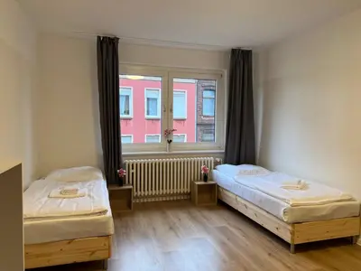 Ein Bett oder Betten in einem Zimmer der Unterkunft T&K Apartments - Duisburg - 3 Zimmer Apartment