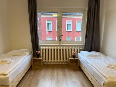 Ein Bett oder Betten in einem Zimmer der Unterkunft T&K Apartments - Duisburg - 3 Zimmer Apartment