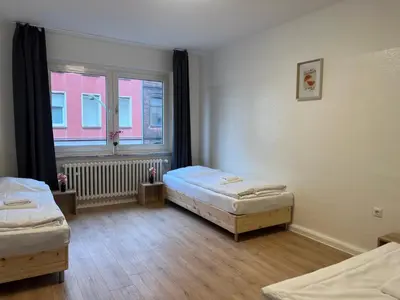 Ein Bett oder Betten in einem Zimmer der Unterkunft T&K Apartments - Duisburg - 3 Zimmer Apartment