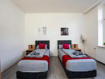 Ein Bett oder Betten in einem Zimmer der Unterkunft Serviceroom24 - Space in Recklinghausen Hoch WLAN - Smart-TV - 24-7 Check-in und Küche