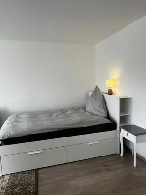 Ein Bett oder Betten in einem Zimmer der Unterkunft Fewo Sonnenblick - Zentrumsnah und grün in Essen