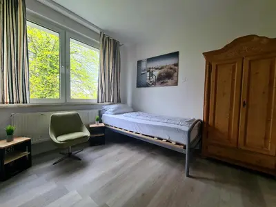 Ein Bett oder Betten in einem Zimmer der Unterkunft B1- Appartements