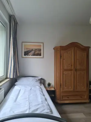 Ein Bett oder Betten in einem Zimmer der Unterkunft B1- Appartements