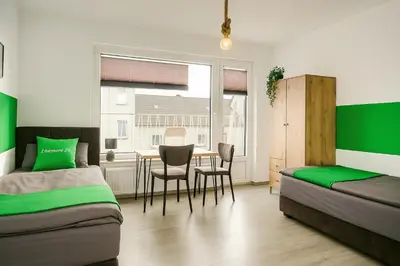 Ein Bett oder Betten in einem Zimmer der Unterkunft Livemore24 - Apartment 1 in Duisburg WLAN - Smart-TV - 24-7 Check-in und Küche