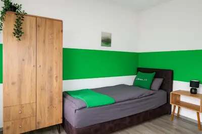 Ein Bett oder Betten in einem Zimmer der Unterkunft Livemore24 - Apartment 1 in Duisburg WLAN - Smart-TV - 24-7 Check-in und Küche