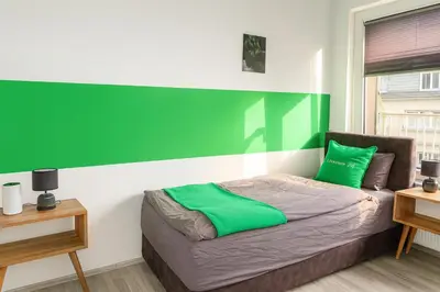 Ein Bett oder Betten in einem Zimmer der Unterkunft Livemore24 - Apartment 1 in Duisburg WLAN - Smart-TV - 24-7 Check-in und Küche