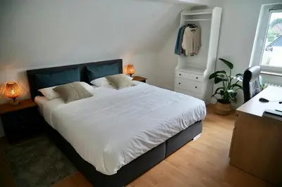 Ein Bett oder Betten in einem Zimmer der Unterkunft Modern 2.5 Bedroom Duplex Apartment near Messe, Airport, Arena