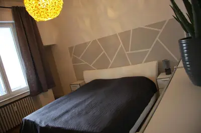Ein Bett oder Betten in einem Zimmer der Unterkunft Grillo31 Erdgeschosswohnung