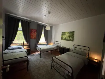 Ein Bett oder Betten in einem Zimmer der Unterkunft Ferienwohnung Obernahmer