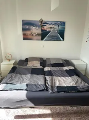 Ein Bett oder Betten in einem Zimmer der Unterkunft Im Herzen von Bochum