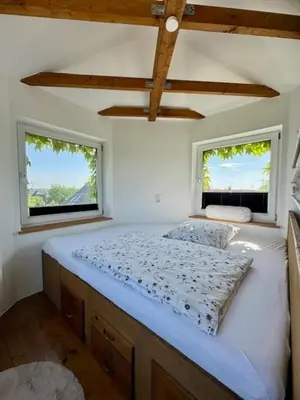 Ein Bett oder Betten in einem Zimmer der Unterkunft Turm auf altem Bauernhof