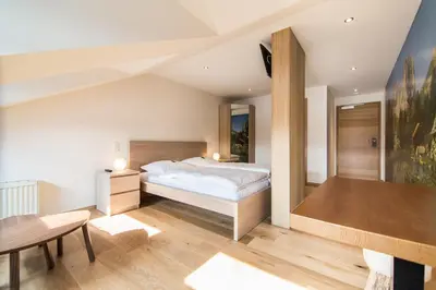 Ein Bett oder Betten in einem Zimmer der Unterkunft Südtiroler Stuben