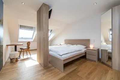 Ein Bett oder Betten in einem Zimmer der Unterkunft Südtiroler Stuben