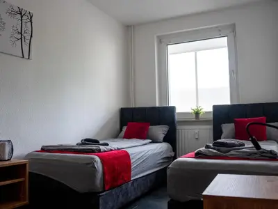 Ein Bett oder Betten in einem Zimmer der Unterkunft Livemore24 - Apartment 4 in Duisburg WLAN - Smart-TV - 24-7 Check-in und Küche