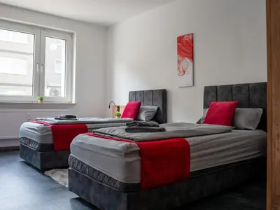Ein Bett oder Betten in einem Zimmer der Unterkunft Livemore24 - Apartment 4 in Duisburg WLAN - Smart-TV - 24-7 Check-in und Küche