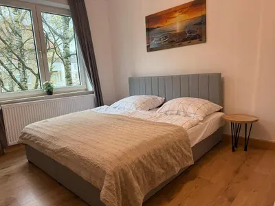 Ein Bett oder Betten in einem Zimmer der Unterkunft Home im Pott - Sehr Zentral - 4 Pers, TV
