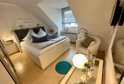 Ein Bett oder Betten in einem Zimmer der Unterkunft Apartment Orchidee