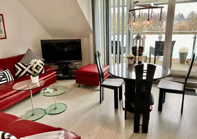 Ein Sitzbereich in der Unterkunft Apartment Orchidee