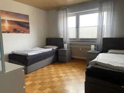 Ein Bett oder Betten in einem Zimmer der Unterkunft Ferienwohnung mit Garten am Niederrhein