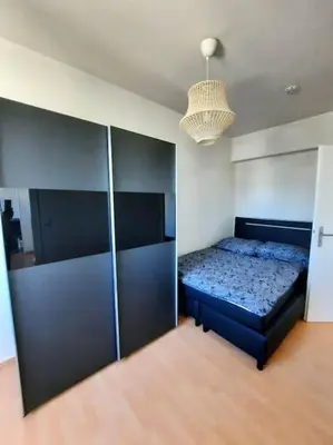Ein Bett oder Betten in einem Zimmer der Unterkunft City-Wohnung mit Ausblick