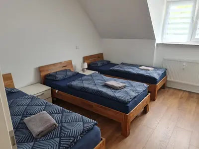 Ein Bett oder Betten in einem Zimmer der Unterkunft Schöne Dachgeschoss Wohnung