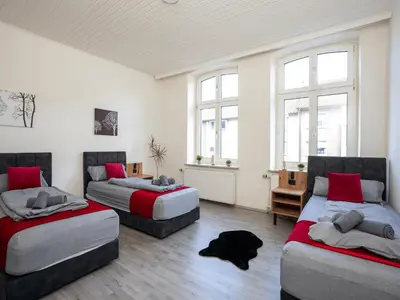 Ein Bett oder Betten in einem Zimmer der Unterkunft Serviceroom24 - Apartment 5 in Recklinghausen WLAN - Smart-TV - 24-7 Check-in und Küche