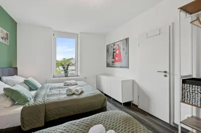 Ein Bett oder Betten in einem Zimmer der Unterkunft Elegant & Bright ~ Near Schalke 04 ~ Office ~ Free Parking!