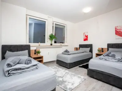Ein Bett oder Betten in einem Zimmer der Unterkunft Serviceroom24 - Apartment 3 in Recklinghausen WLAN - Smart-TV - 24-7 Check-in und Küche