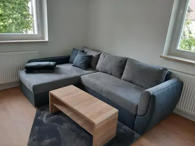 Ein Sitzbereich in der Unterkunft City Apartment 1#Netflix &Wlan &Kingsize Bett &Kaffee Maschine & Zentral & 500m Innenhafen & 2 min U Bahn