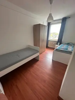 Ein Bett oder Betten in einem Zimmer der Unterkunft Domum 7 Ferien- Monteurapartments inkl Wlan und Waschmaschine in Kamen
