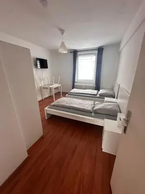 Ein Bett oder Betten in einem Zimmer der Unterkunft Domum 7 Ferien- Monteurapartments inkl Wlan und Waschmaschine in Kamen