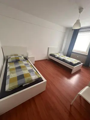 Ein Bett oder Betten in einem Zimmer der Unterkunft Domum 7 Ferien- Monteurapartments inkl Wlan und Waschmaschine in Kamen