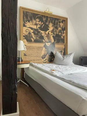Ein Bett oder Betten in einem Zimmer der Unterkunft Hotel der Lennhof