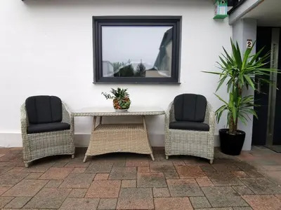 Ein Sitzbereich in der Unterkunft Apartment bei der Palme mit Sauna Möglichkeit