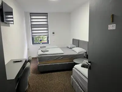 Ein Bett oder Betten in einem Zimmer der Unterkunft Duisburger Hostel