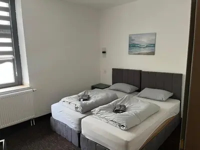 Ein Bett oder Betten in einem Zimmer der Unterkunft Duisburger Hostel
