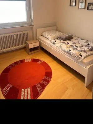 Ein Bett oder Betten in einem Zimmer der Unterkunft Ruhige FeWo am Wasserschloss