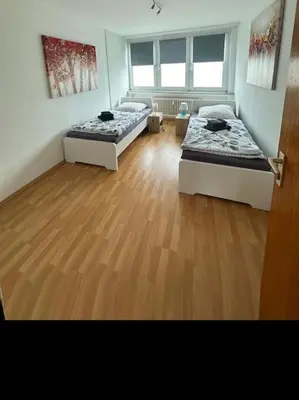 Ein Bett oder Betten in einem Zimmer der Unterkunft Ruhige FeWo am Wasserschloss