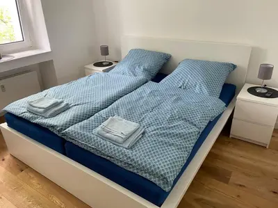 Ein Bett oder Betten in einem Zimmer der Unterkunft Pempelforter Domizil
